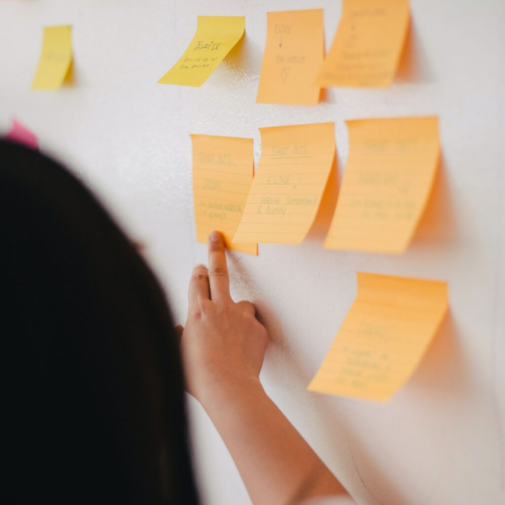 a woman discussing about notes to grow new companies